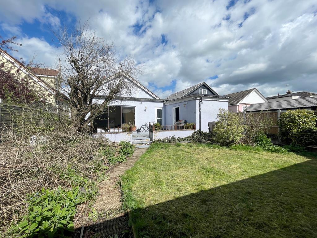 Lot: 93 - DETACHED BUNGALOW FOR IMPROVEMENT - rear garden looking back at the bungalow